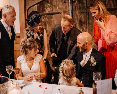 The Bride and groom and family amazed at the special wedding magic gift for the couple on their wedding day