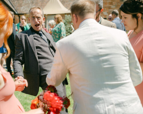 Barns and Yard Worcester pocket magic Brett Sirrell creating fun and laughter with wedding guests as he performs interactive magic